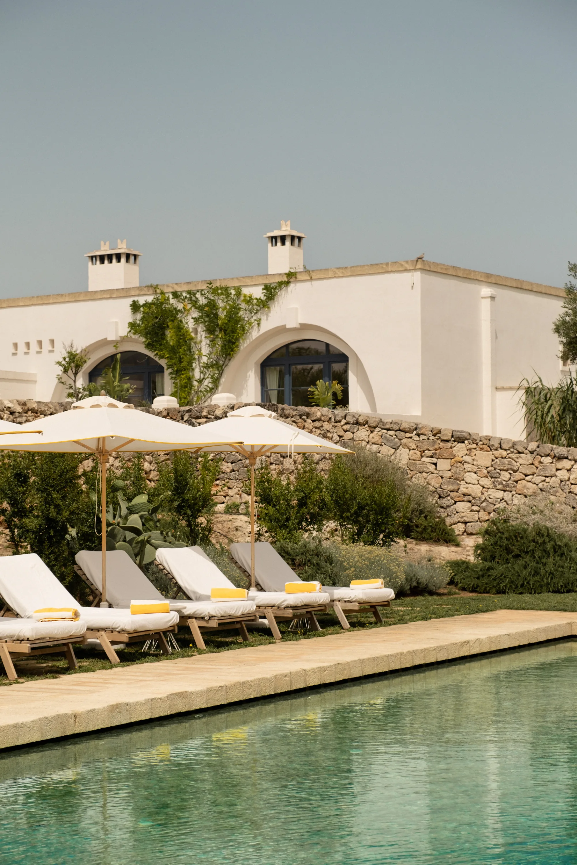 Bar and lounge at Masseria Calderisi with a member of the team, service culture delivered consistently