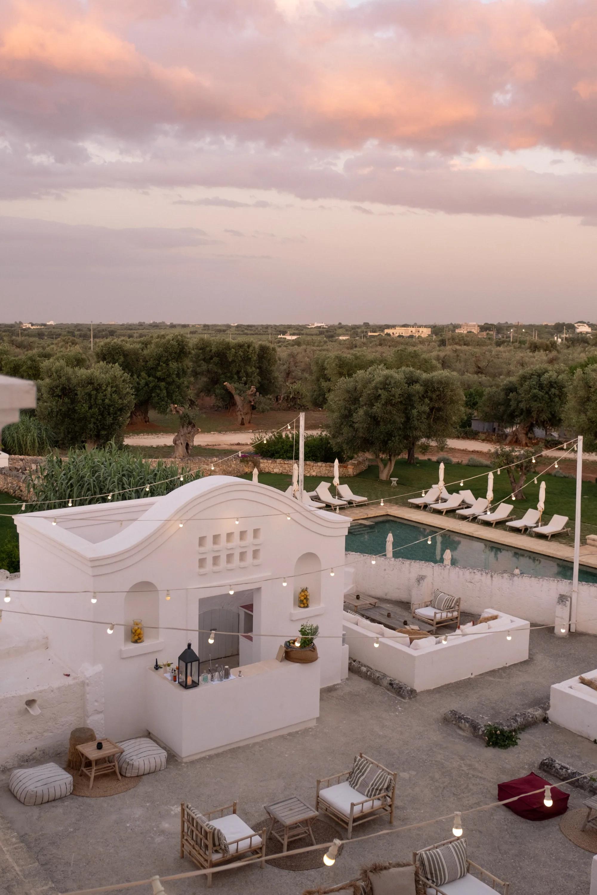 Masseria Calderisi grounds at golden hour, authentic Italian hospitality